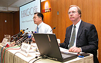 HKGCC CEO Dr Eden Woon (left) and Chief Economist David O'Rear disclose the findings of the Chamber's 6th Annual Business Prospects Survey which presented an upbeat view for 2004.