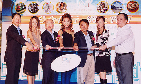 Representatives from the Chamber and government launch the "e-Commerce in Real Life" roadshows with the winners of the Miss Hong Kong Pageant 2003. 